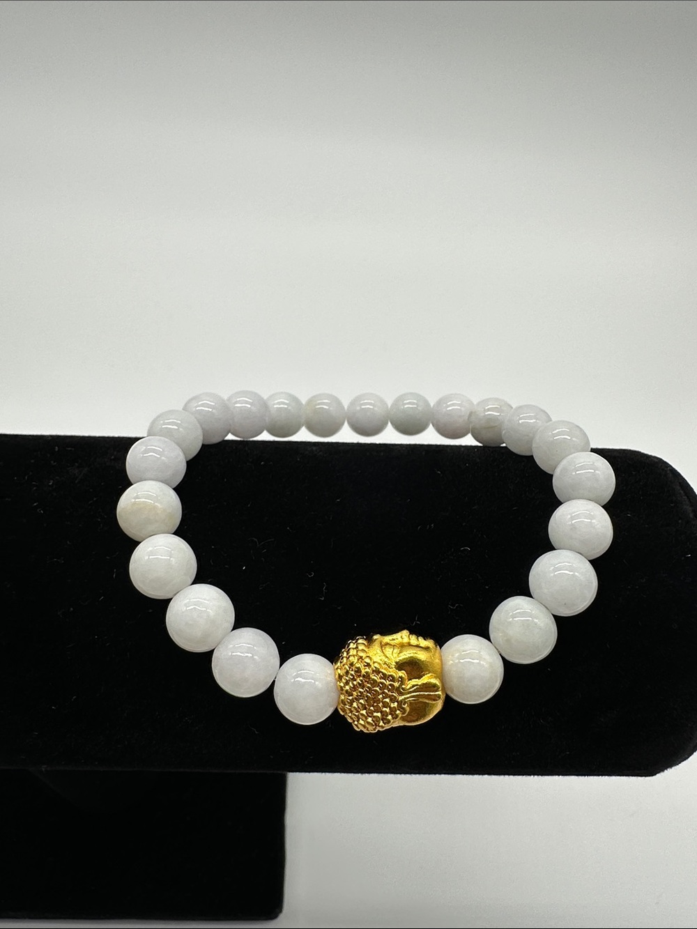 White Jade Bracelet with Gold Buddha Accent